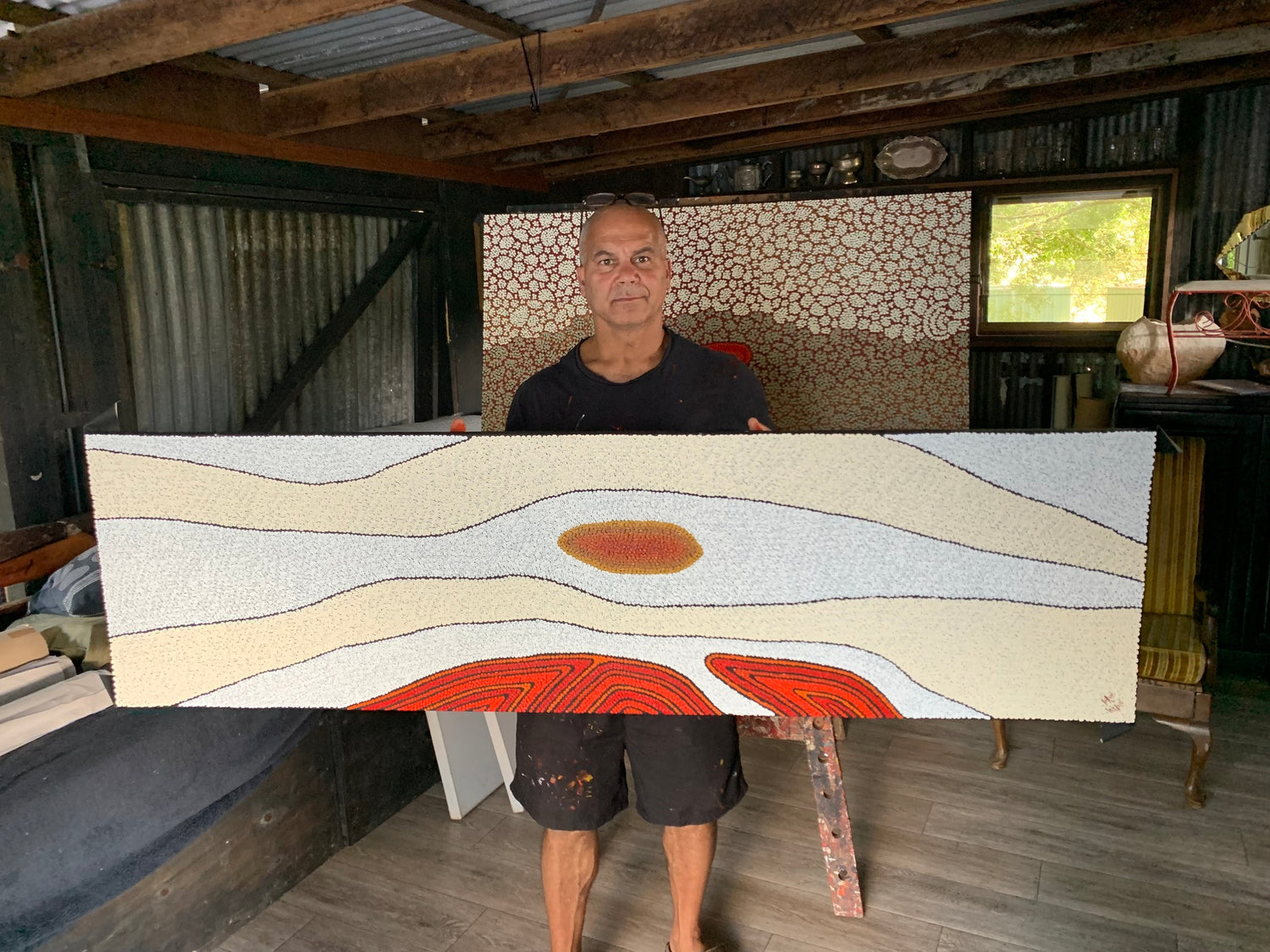 Kurun Warun holding his aboriginal art
